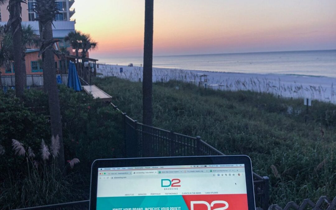 D2 Branding and Marketing laptop overlooking beach