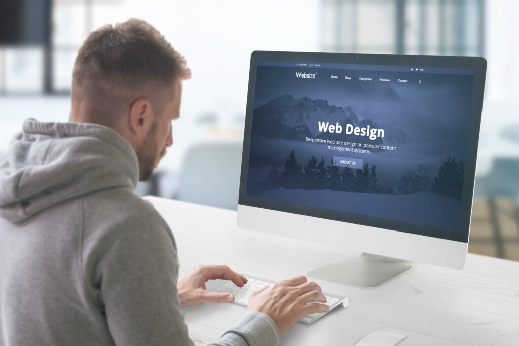 Website designer sitting at workstation